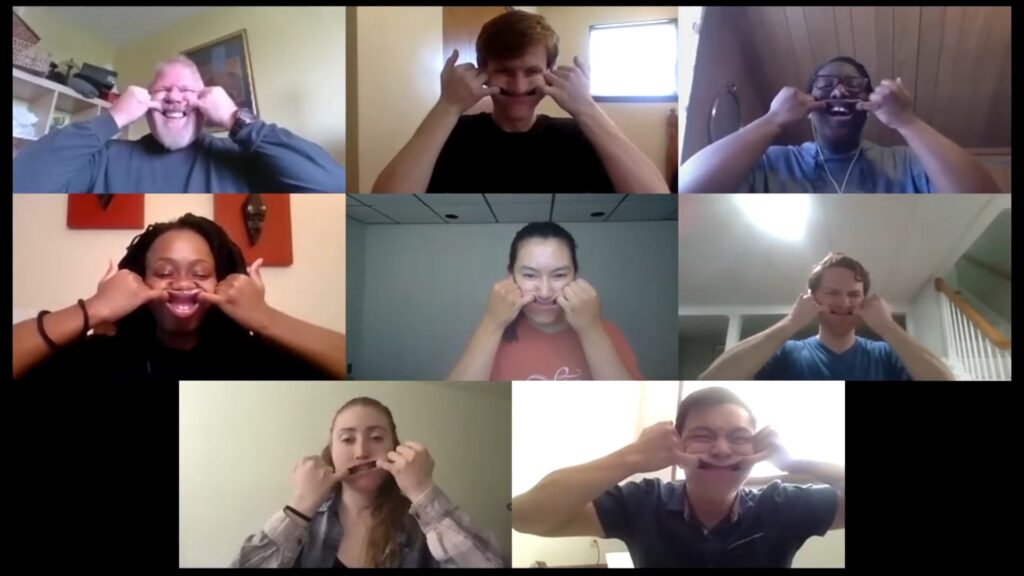 screenshot from workshop on Zoom, showing participants making faces